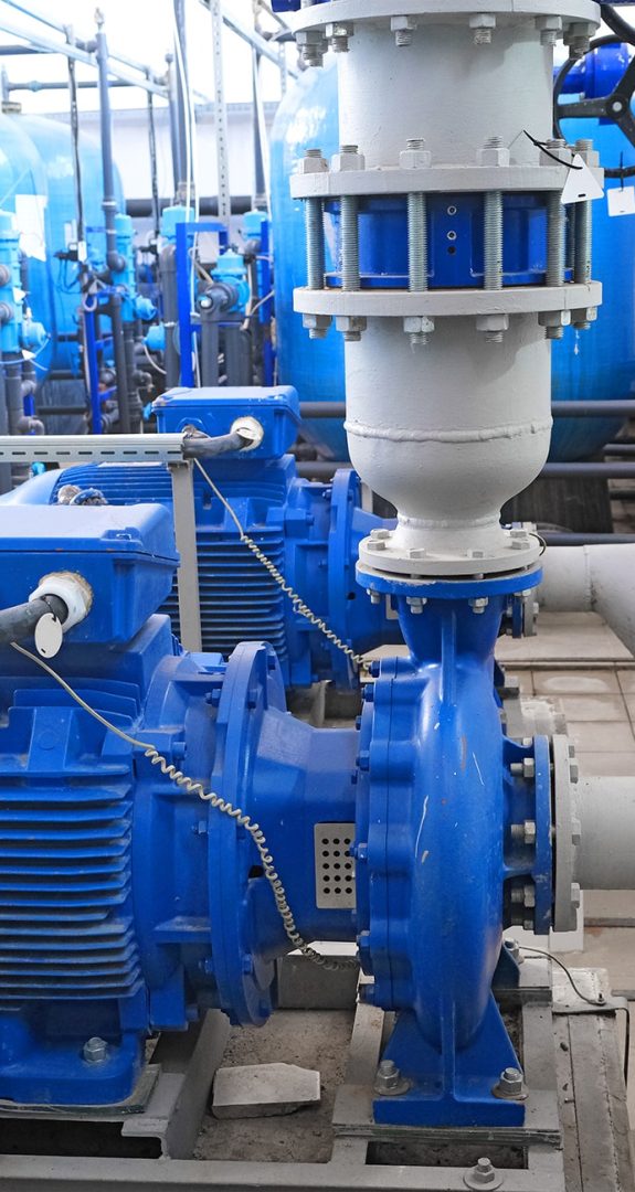 Commercial water pump system with electric motors and pipework in a plant room